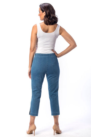 Holland Ave Susan Denim Crop Pant in Vintage Blue. Pull on hidden waistband pant with faux zipper flap. Snug through hip falls straight to hem. Side slits. 25" inseam._13120006324322