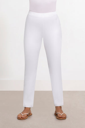 Sympli Narrow Pant Midi in White. Hidden elastic waist pull on pant with slim leg. Side slits at hem. 28" inseam_33995505303752