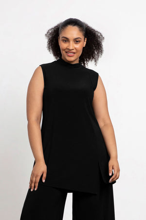 Sympli Sleeveless Mock Neck Slit Tunic in Black. Mock neck long top with asymmetric front hem. Off side wrapped seam with slit. Relaxed fit. Tunic length._34038761259208