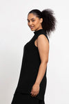 Sympli Sleeveless Mock Neck Slit Tunic in Black. Mock neck long top with asymmetric front hem. Off side wrapped seam with slit. Relaxed fit. Tunic length._t_34038761095368