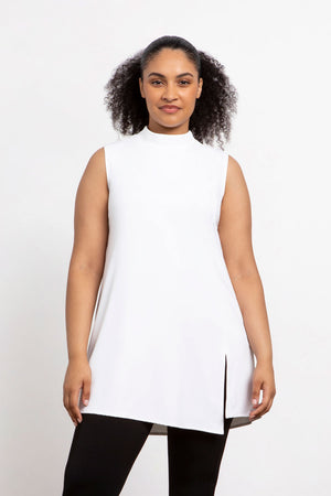 Sympli Sleeveless Mock Neck Slit Tunic in White.  Mock neck long top with asymmetric front hem.  Off side wrapped seam with slit.  Relaxed fit.  Tunic length._34038761291976